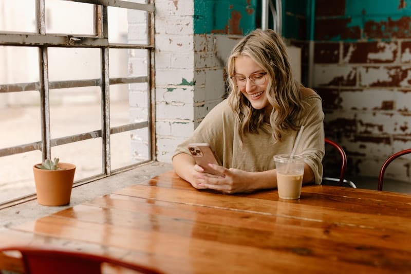 Small business owner using WhatsApp Business on phone